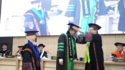 Resmi Sandang Gelar Doktor, Bupati BBS Angkat Isu Kesejahteraan Petani Sawit Muaro Jambi